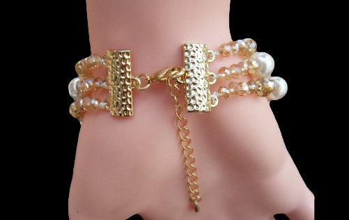 Bracelet de mariée en métal doré à 3 brins de fausses perles avec fermoir en strass transparent